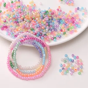 Close-up of 4mm cream glass seed beads for DIY jewelry making with colorful bracelet samples