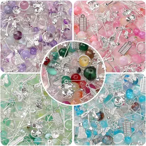 Detailed view of colorful mixed glass beads and silver alloy charms for DIY jewelry