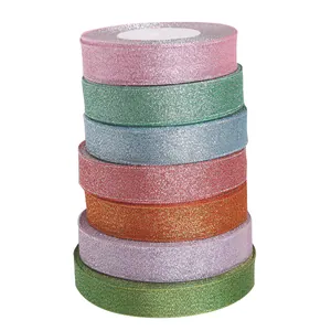 Stack of vibrant colorful glitter metallic ribbons for DIY hair bows and gift wrapping crafts