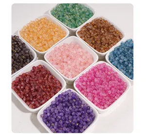 Close-up detail of 7mm frosted glass beads with gold foil speckles in various colors