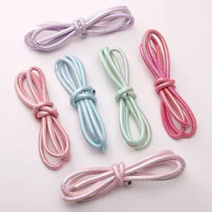 Detailed macro view of 6mm iridescent metallic braided leather ropes for DIY jewelry making