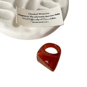 Geometric faceted resin ring with amber marbled texture for a unique vintage style.