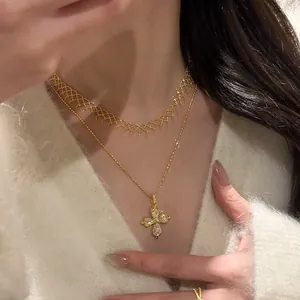 Detailed view of layered gold mesh choker and elegant cross pendant necklace on model