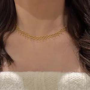 Detailed view of an elegant gold mesh lace necklace worn on the neck for a chic look
