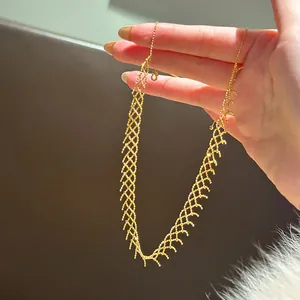 Detailed close-up view of an elegant gold beaded mesh lace necklace fashion accessory