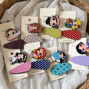 Close-up of cute cartoon girl and patterned acetate hair clips in a wicker basket.