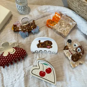 Selection of cute acetate hair claw clips with dog, cherry and bread designs