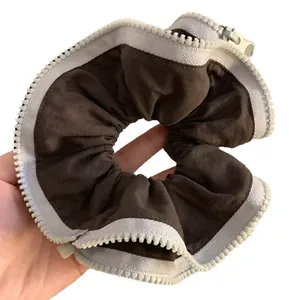Unique zipper design hair scrunchie with contrast dark brown and white fabric tie