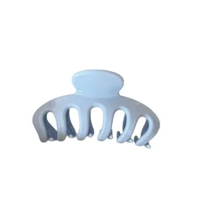 Large light blue Korean style hair claw clip for elegant updos on white background