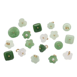 Various faux jade glass flower and square charms for DIY jewelry making projects