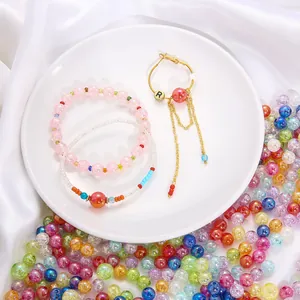 Detailed view of vibrant AB coated acrylic bubble beads and handmade beaded jewelry