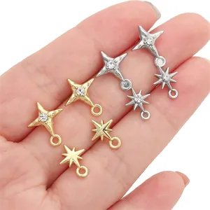 Close-up detail of star charms in gold and silver with rhinestones for DIY jewelry making