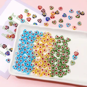 Close-up macro view of colorful millefiori lampwork glass heart beads for DIY jewelry making