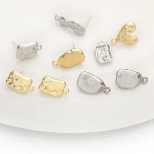 Mixed metallic alloy earring components in gold and silver plating for DIY jewelry crafting.