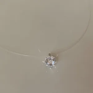 Close-up of a sparkling round cubic zirconia pendant on an invisible fishing line