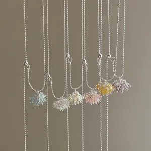 Detailed view of colorful crystal grape cluster pendants on silver adjustable chains