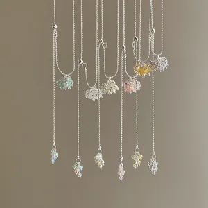 Detailed view of colorful crystal grape cluster long necklaces in various pastel shades