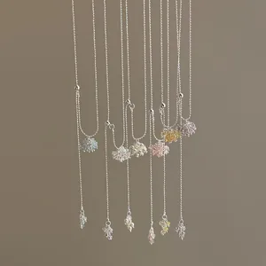 Detail showing various colorful crystal grape cluster long necklaces with adjustable silver chain