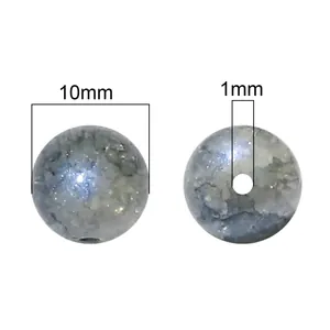 Close-up detail of 10mm round aurora glass beads with 1mm hole for DIY jewelry making