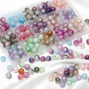 Detail view of colorful aurora cracked glass beads in a storage box for DIY jewelry.