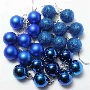 Close-up of blue Christmas ornament balls in matte, glitter, and glossy finishes