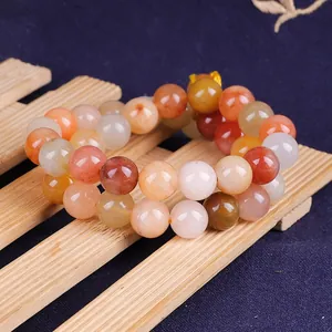 Close-up of colorful natural silk jade round beads for handmade jewelry making