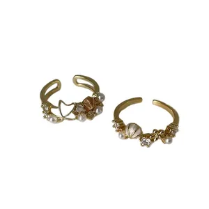 Elegante goldene offene Ringe mit Zirkonia-Perlen, Muscheln und Seesternen für Damen