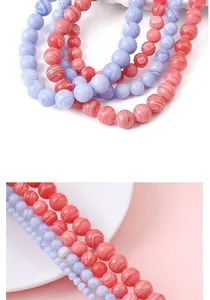 Vue détaillée des perles de pierre rondes synthétiques rayées pour bijoux DIY
