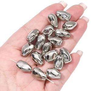 Close-up of silver CCB irregular metallic loose beads for DIY jewelry making accessories