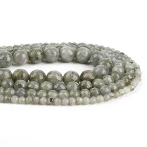 Macro view of faceted natural stone beads showing delicate texture for DIY jewelry.