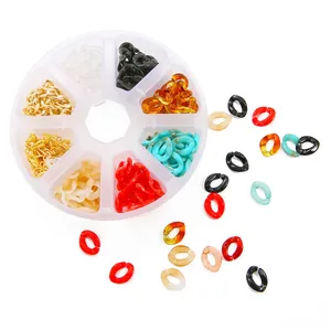 Detail of 8-compartment box with colorful acrylic twisted chain links for DIY jewelry.