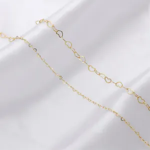 Close-up of 14K gold filled heart-shaped link chains for DIY handmade jewelry making