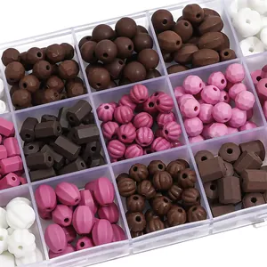 Detailed view of assorted ceramic beads in various shapes and colors for DIY jewelry