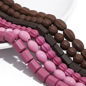 Macro view of assorted ceramic beads in vintage pink and brown for DIY jewelry making.