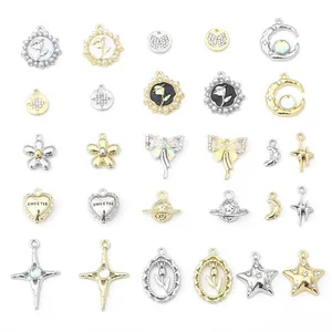 A collection of gold and silver alloy charm pendants for DIY jewelry making and crafts