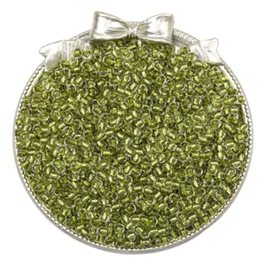 Macro view of olive green silver-lined glass seed beads for DIY jewelry making crafts