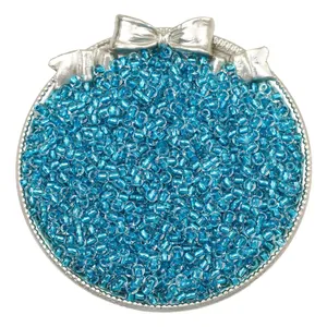 Detailed macro view of blue silver-lined glass seed beads for DIY jewelry making