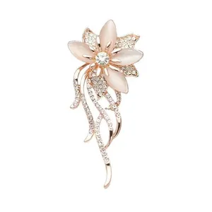 Elegant rose gold flower brooch with cat eye stone petals and sparkling crystal accents