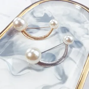 Elegant U-shaped pearl brooch set in gold and silver finish for garment accessories