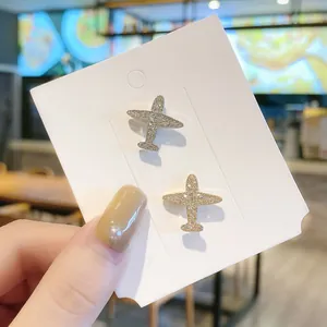 Set aus zwei gold- und silbernen Flugzeug-Broschen mit Strass für Damenbekleidung