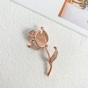 Elegant rose gold flower brooch with peach stone and rhinestone accents for scarves