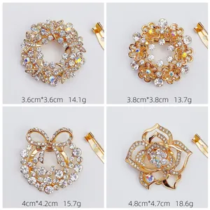 Detailed size and weight comparison of four sparkling crystal-studded scarf clips.