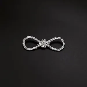 Macro shot of an elegant silver bow brooch embellished with sparkling rhinestones