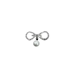 Elegant silver-tone rhinestone bow brooch featuring a white pearl pendant for women