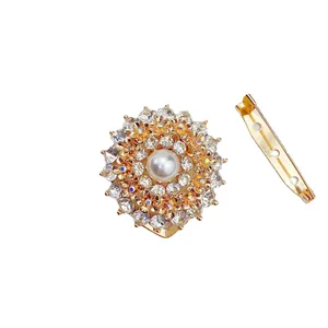 Elegant golden floral scarf clip with central faux pearl and sparkling crystal rhinestones