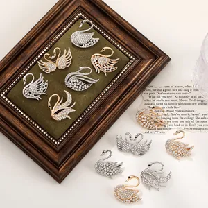 Elegant alloy swan brooches with sparkling rhinestones in gold and silver color finish