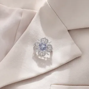 Detailed macro view of an elegant vintage hollow crystal brooch on a blazer lapel
