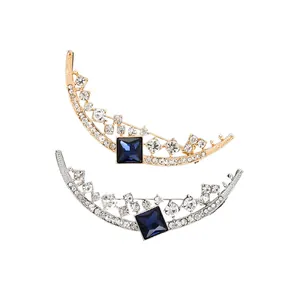 Elegant crescent moon brooch pins set with blue gemstones and sparkling rhinestones