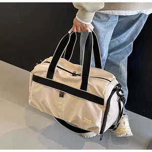 Large capacity beige oxford travel bag with black accents and adjustable crossbody strap