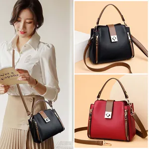 Elegante bolso tipo cubo para mujer en cuero sintético con asa y correa ajustable